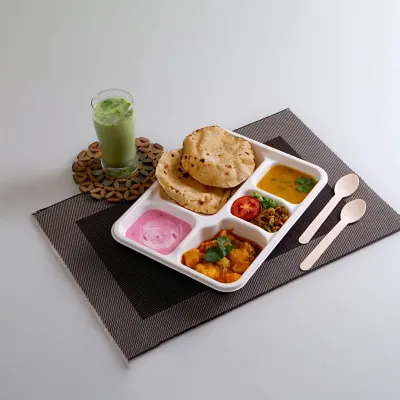 Bagasse compartment tray holding a breakfast service with a drink