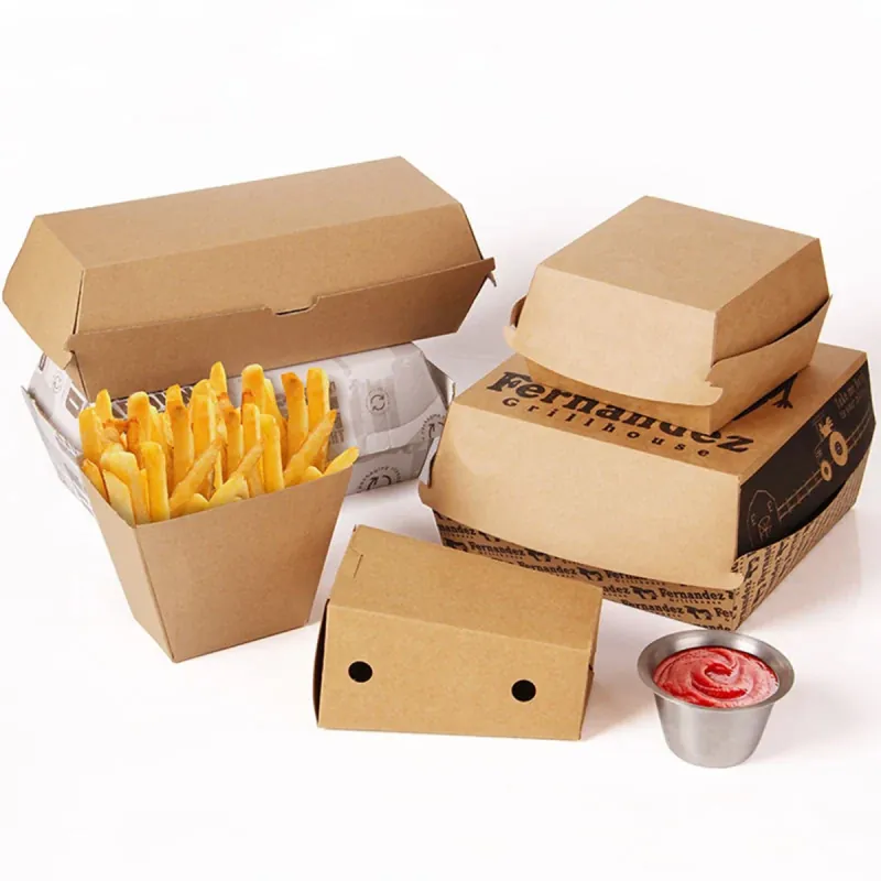 Kraft burger clamshells and side boxes shown together with fries and dips