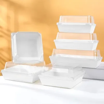 Stack of white compartment trays with lids in several sizes