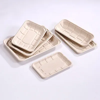Stack of moulded fibre food trays in several sizes