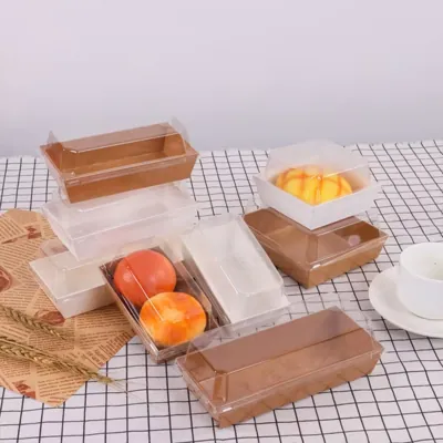 Set of kraft trays with clear lids alongside a corn dog tray