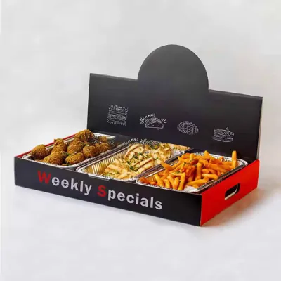 Printed black corrugated catering tray with a raised header board holding foil pans of fried food