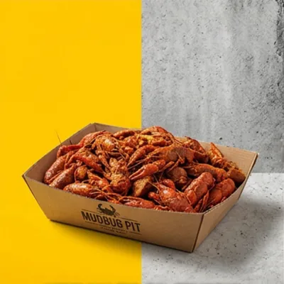 Printed corrugated crawfish tray holding a boil portion on a grey background