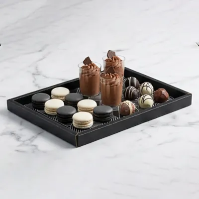 Matt black dessert platter holding macarons, truffles and chocolate desserts