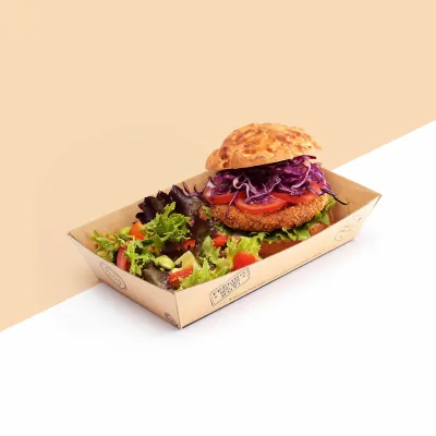 Corrugated food tray holding a burger and salad on a plain background