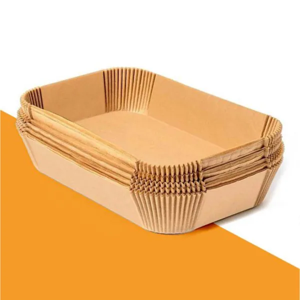 Stack of pleated kraft paper pan liners for a rectangular baking pan