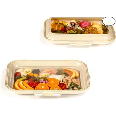 Moulded fibre crudité trays with clear lids holding vegetable and fruit selections