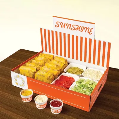 Orange striped printed catering tray holding taco fillings and dips