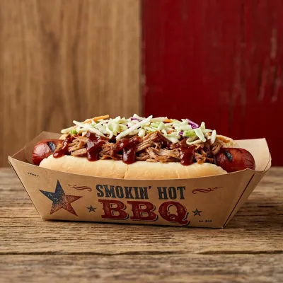 Printed hot dog tray with a smokehouse barbecue design holding a pulled pork hot dog