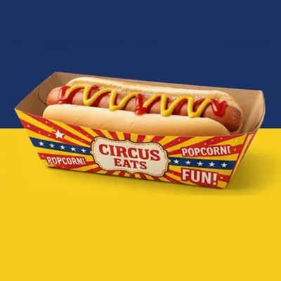 Brightly printed circus-style hot dog tray holding a mustard-topped hot dog