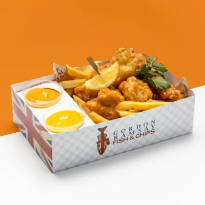 Printed fish and chips tray holding battered fish, chips and two dip pots
