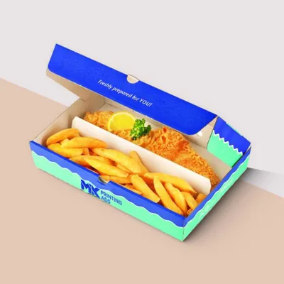 Blue printed fish and chips box holding battered fish and chips