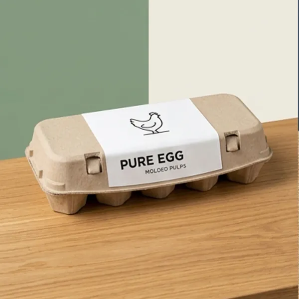 Moulded fibre egg carton with a printed paper band on a wooden table