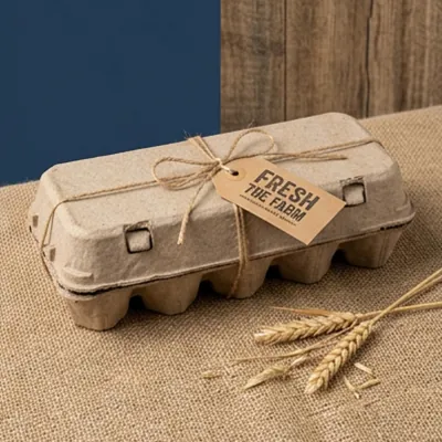 Moulded fibre egg carton tied with string and a printed farm tag