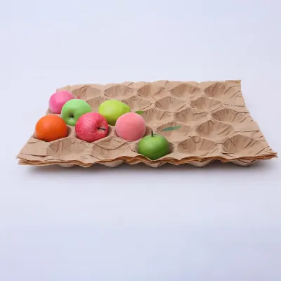 Kraft moulded fibre fruit tray holding apples in formed pockets