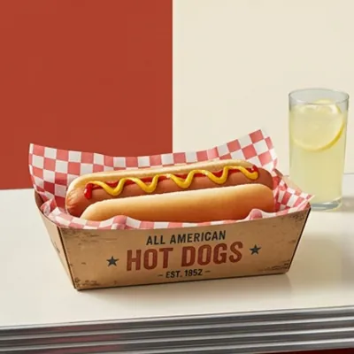 Printed hot dog tray with a diner design holding a mustard-topped hot dog