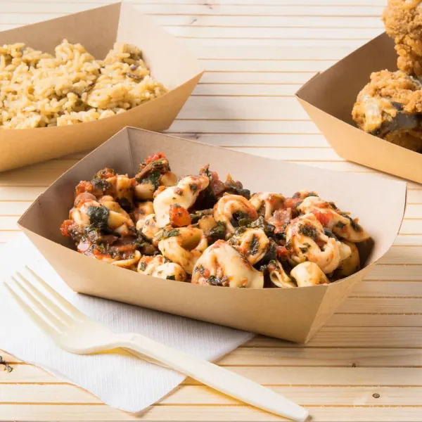 Natural kraft paper food tray holding a served portion on a counter