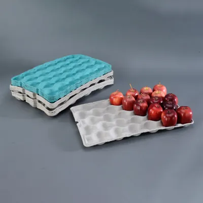 Stacked moulded fibre produce trays in white and blue holding apples