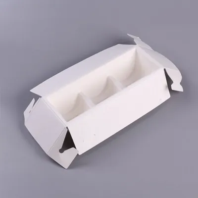 White insert tray with three wells for individual cakes, shown open