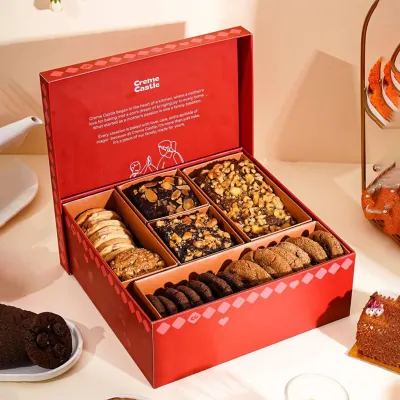 Red rigid catering platter with a fitted insert holding brownies, cookies and popcorn
