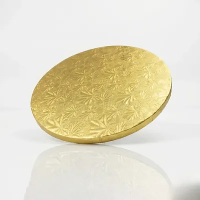 Single gold foil round cake board with an embossed pattern
